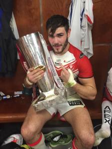 Alex Walmsley celebrating with the Grand Final Trophy